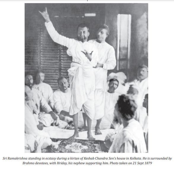 Sri Ramakrishna standing in ecstasy among devotees at Keshab Chandra Sen's house, 1879